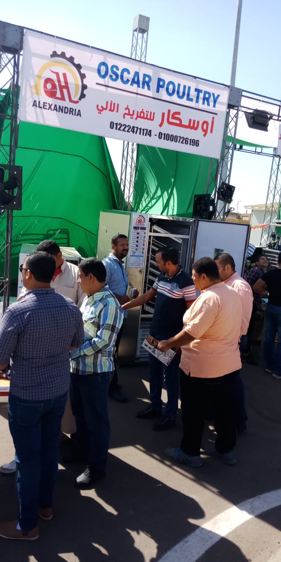 Visitors interacting with Oscar products at an outdoor exhibition booth