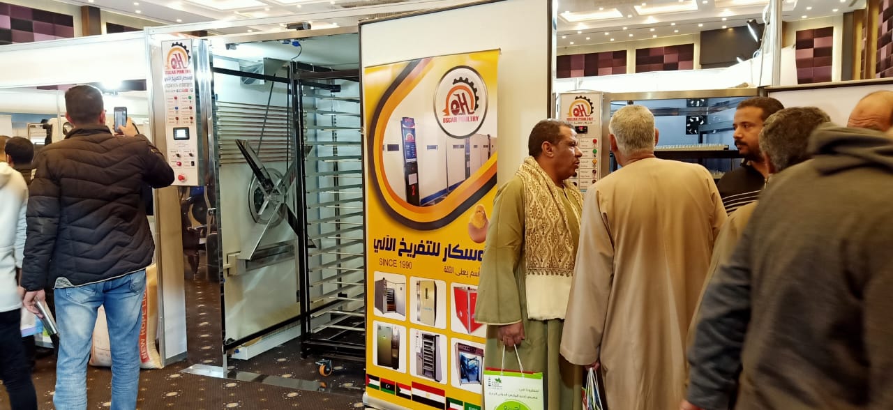 Visitors watching an Oscar equipment presentation inside the exhibition